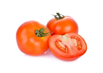 whole and portion cut fresh tomato on white background