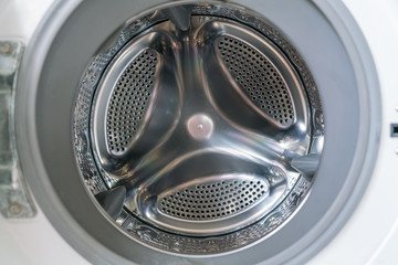 White washing machine with opened door close-up - Empty inside 