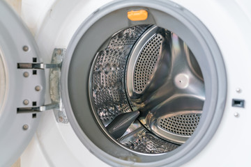 White washing machine with opened door close-up - Empty inside 