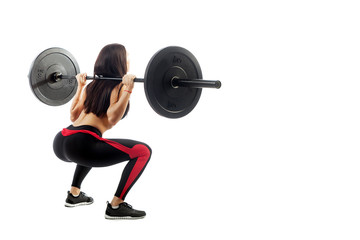 Young sporty woman fitness model brunette doing a seated pad with a barbell on white isolated...