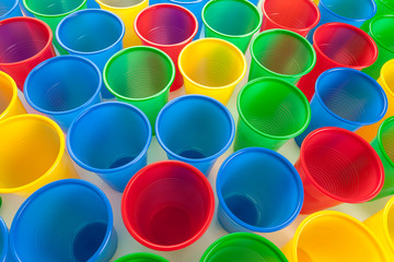 Multicolor plastic glasses isolated on white background