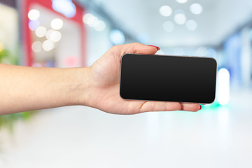 Mock up smartphone with blank screen in woman hands