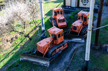Red bulldozers at a construction site