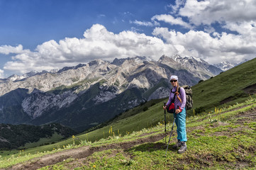 Fototapeta na wymiar girl on the background of mountain scenery