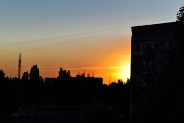 Sunset on the background of the house