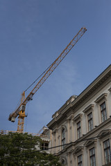 Fototapeta na wymiar Big load crane at a construction site.