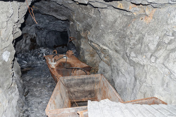 an abandoned mine in Kyrgyzstan, abandoned trolley underground remains of underground workings