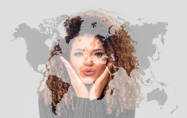 Double exposure of lovely woman giving kiss and world map