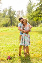 Fototapeta premium happy young couple hugging on nature