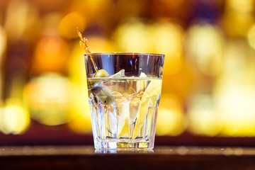 Gin tonic cocktail on the bar. Alcoholic beverage (close)