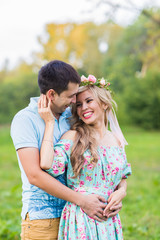 Fototapeta premium happy young couple hugging on nature