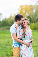 happy young couple hugging on nature