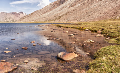 Landscape of mountains and glaciers in the sunny weather. mountain river, lake.