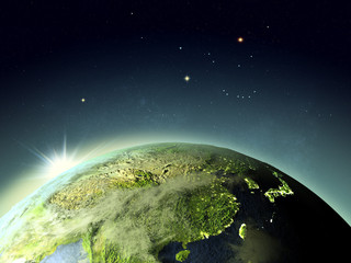 Sunset above East Asia from space