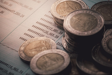 coins on bank account passbook