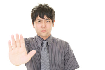 ストップのジェスチャーをする男性