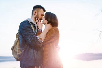 Young tourist couple at sunset sun