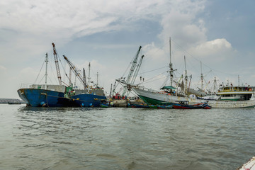 Sunda Kelapa old Harbour with fishing boats, ship and docks in Jakarta, Indonesia