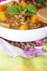 Lentil casserole with wooden spoon