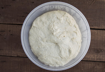 Kneading dough, fermented dough in a basin, dough for making bread
