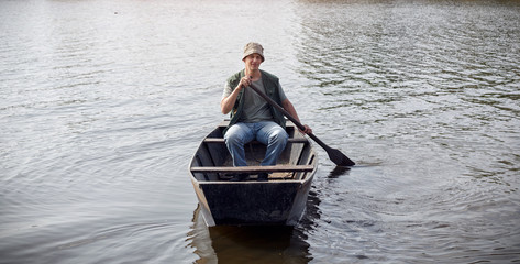 young man in fishing boat .