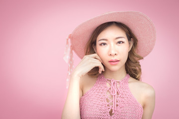 Beautiful korea woman posing at pink background with summer concept, isolated on pink background, 20-30 year old.