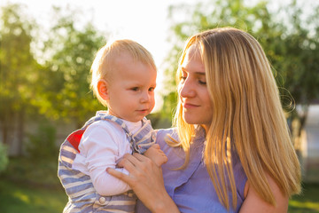 baby boy with his mum outdoors