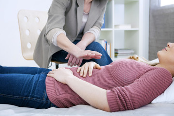Woman undergoing hypnosis session