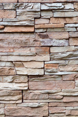 Texture of rough gray stone brick wall