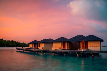 Fototapeta na wymiar Tropical Beach with Water-Bungalows on the Maldives