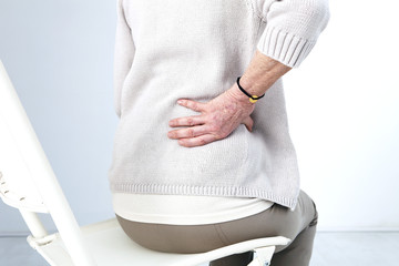 Lower back pain in elderly person