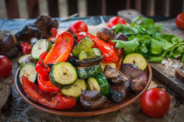  Cooked barbecue with vegetables.