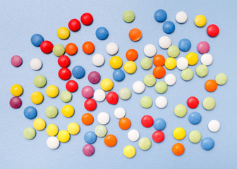 lollipops, candy, top view flat lay on blue background