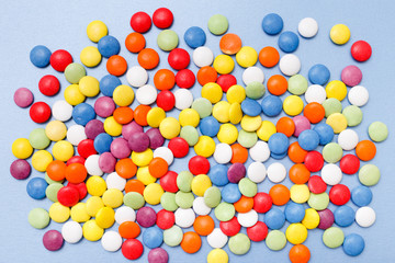 lollipops, candy, top view flat lay on blue background