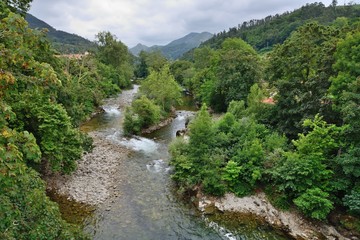 landscape with a river at the bottom of the mountain gorge