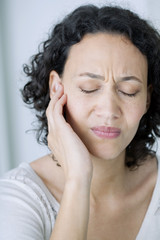 Woman suffering from earache