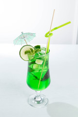 Lemonade tarhun or estragon with ice and lime on white background