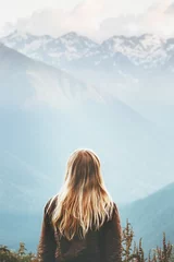 Fototapeten Blonde Woman enjoying mountains landscape Travel Lifestyle wanderlust concept adventure summer vacations outdoor girl traveler in harmony with nature © EVERST