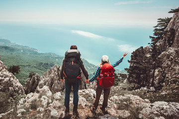 Happy Couple Man and Woman holding hands enjoying mountains aerial view Love and Travel emotions Lifestyle concept. Young family traveling together active adventure vacations