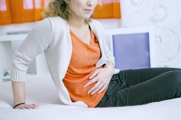 Woman suffering from abdominal pain