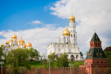 Fototapeta na wymiar Moscow, Russia. Archangel Cathedral, Ivan the Great Bell tower, a tower and a fragment of the Kremlin wall.
