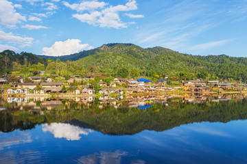 Fototapeta na wymiar Beautiful lake and sky view of the Rak Thai village and mountain reflection in Pai district, Mae Hong Son Province, Thailand. 