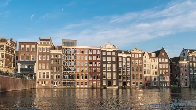 Amsterdam city skyline timelapse at Damrak canal waterfront, Amsterdam, Netherlands, 4K Time Lapse