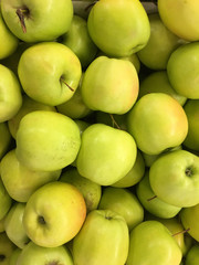 Top view of green yellow apples in pile