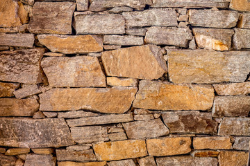 Stone wall with randomly shaped stones