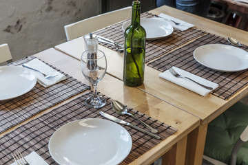 Empty covered table in the restaurant