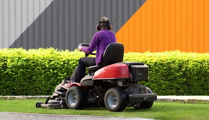 Woman with garden lawn mower