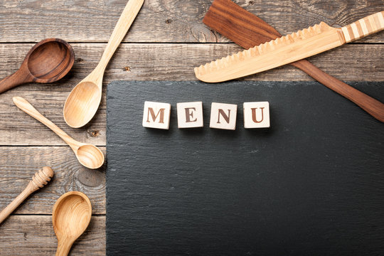 Blackboard menu and wooden utensils
