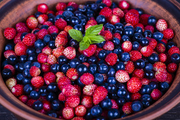 Fresh strawberries and blueberries , wild berry.