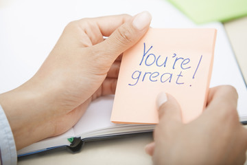 Positive text on adhesive note